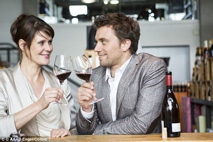 couple sitting at right angle to each other 434x290